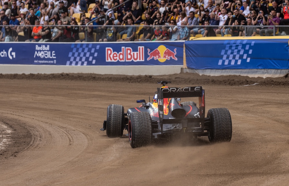Speed Demons Showdown: F1 Racing Car vs Speedway Bike on Dirt