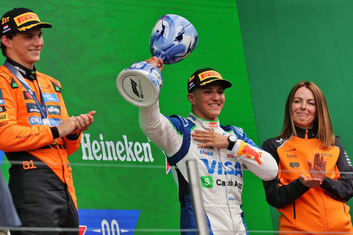 In the Heat of Victory: F1 Driver Shatters Trophy in Celebration on Podium!